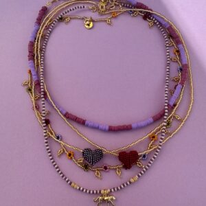 zestaw naszyjników, okrągły, z gepardem, z serduszkami i z kwiatuszkami